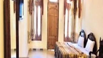 Deluxe Quadruple Room | Free WiFi, bed sheets