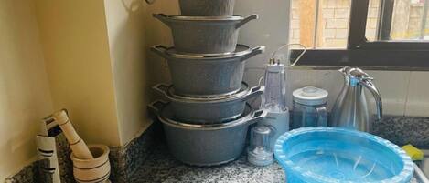 Fridge, microwave, coffee/tea maker, cookware/dishes/utensils