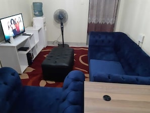 Business Double Room | Living area | 34-inch Smart TV with digital channels, TV - Stay.Plus Mirema Drive Apartment (Nairobi)