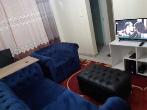 Business Double Room | Living area | 34-inch Smart TV with digital channels, TV - Stay.Plus Mirema Drive Apartment (Nairobi)