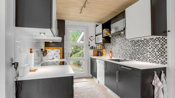 Fridge, stovetop, dishwasher, coffee/tea maker