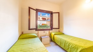 Comfort Apartment, 2 Bedrooms, Kitchenette | Cots/infant beds - Appartamenti Ambra a San Teodoro (San Teodoro)