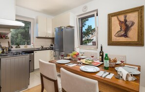Fridge, stovetop, dishwasher, coffee/tea maker