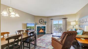 Condo, 1 King Bed with Sofa bed, Balcony (#221 - No Pets) | Living area | 40-inch TV with cable channels, fireplace