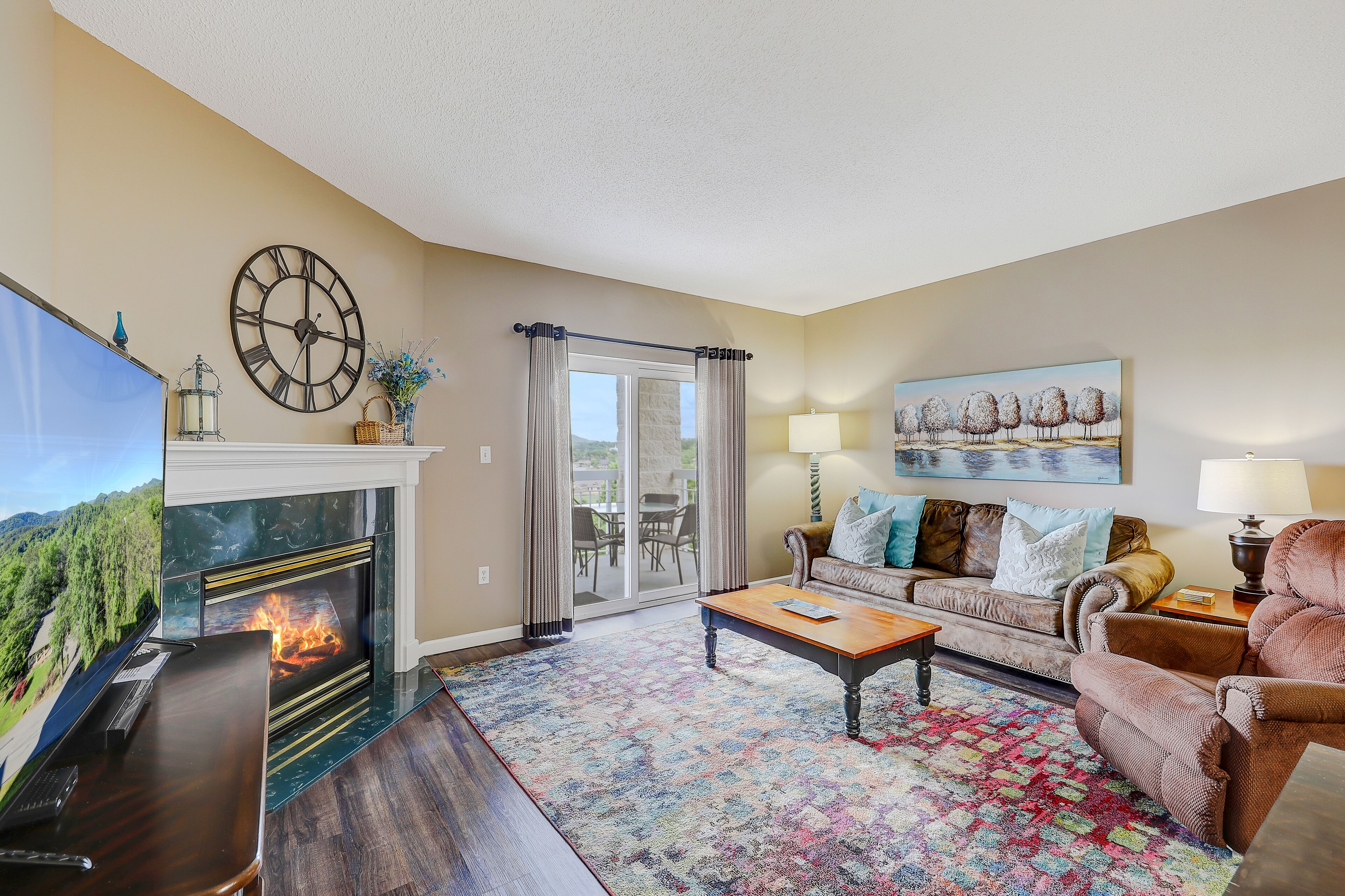 Condo, 1 King Bed with Sofa bed, Balcony (#221 - No Pets) | Living area | 40-inch TV with cable channels, fireplace