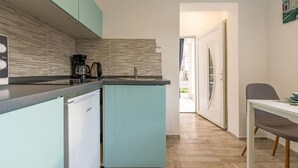 A compact kitchen with a dishwasher, a coffee maker, and a sink. - Stunning apartment in Vir with WiFi (Vir)