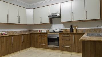 Luxury Apartment, 3 Bedrooms | Private kitchen | Full-sized fridge, microwave, oven, stovetop