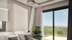 Una camera da letto moderna con un letto grande, una pianta in vaso e vista sul paesaggio.