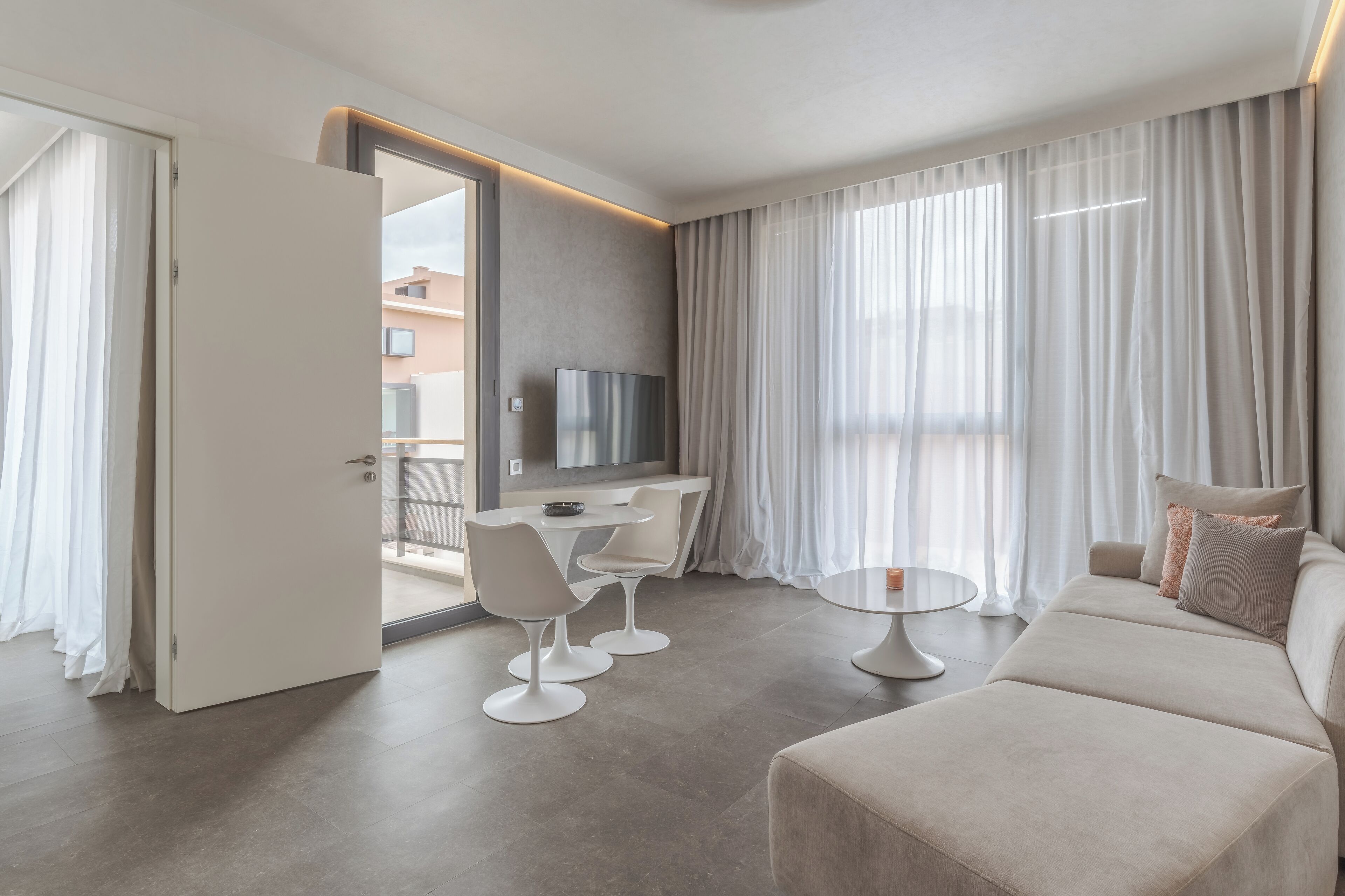 double room (cr7 suite avenue) | living area | 49-inch flat-screen tv with cable channels, tv