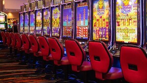 A row of slot machines with red chairs in front, labeled "Golden Egypt." - Private 3Br Apt: King-2Queen -PetPally -LTR-STR (Bay Shore)
