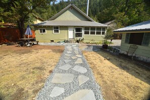 A house with a stone pathway leading to the front door. - ❤Riverfront Paradise - Butterfly Ranch on the River❤ (Dunsmuir)