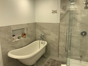 Bathtub, hair dryer, towels, soap