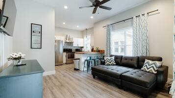 House (614 S. Converse St (Right Side)) | Living room | Flat-screen TV, books