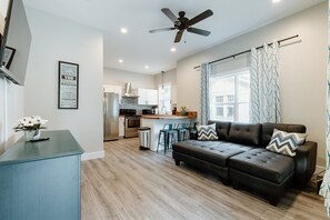 House (614 S. Converse St (Right Side)) | Living room | Flat-screen TV, books