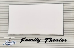 A blank whiteboard on a wall with horizontal lines, labeled "Family Theater" at the bottom. - Huge 4BDR/3BA cottage  in Stormy Point Village with fireplace and rec room! (Branson)
