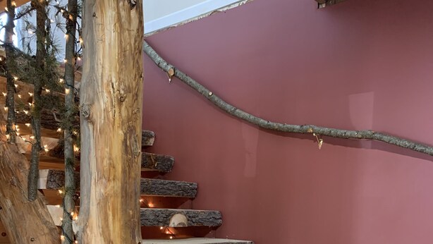 A wooden staircase with a rustic design, featuring a natural wood finish and a simple, functional structure. - Secluded Cabin w/ Private Pond/ Peaceful Getaway (Cameron Mills)