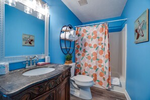 Combined shower/bathtub, hair dryer, towels, toilet paper