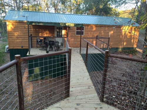 Cabin with a tree house on a working buffalo farm near the Buffalo River.