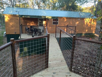 Cabin with a tree house on a working buffalo farm near the Buffalo River.