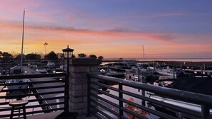 A marina with boats docked, a stone lantern, and a railing. - Studio, Private Entrance, fenced in quiet corner, pets ok, large Parking area (St. Cloud)