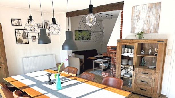 Un comedor con mantel a cuadros, sillas de madera y lámparas colgantes.