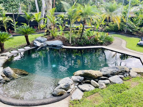 Villa Coral • Tropical Beachside Oasis with Private Garden & Heated Pool