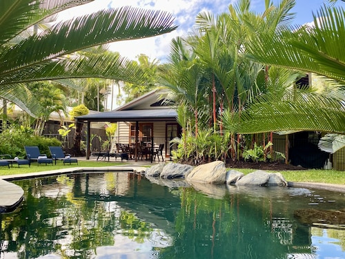 Villa Coral • Tropical Beachside Oasis with Private Garden & Heated Pool