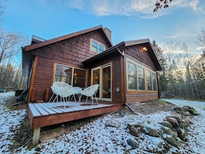 Outdoor dining - Secluded Riverfront Cabin | Hot Tub + Starlink (Ojibwa)
