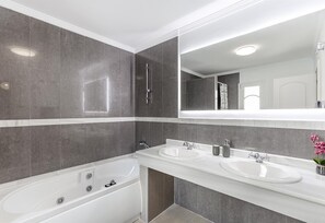 Bathtub, hair dryer, towels