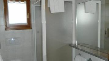 Shower, rainfall showerhead, bidet, towels