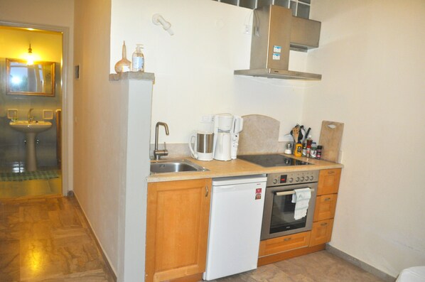 A compact kitchen with a sink, coffee maker, and a dishwasher. - Lemoni Vacation Home - Pelekas, Corfu (Pelekas Korfu)
