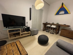 City Apartment | Living area | 43-inch TV with satellite channels, Netflix, DVD player