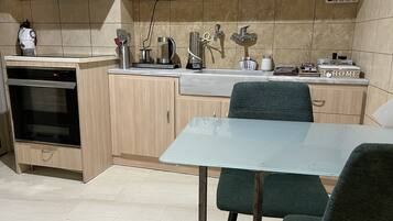 Lägenhet City | Eget kök | Mikrovågsugn, ugn, spishäll och espressobryggare