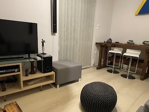 City Apartment | Living area | 43-inch TV with satellite channels, Netflix, DVD player