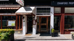 A building with a sign for 'Paffmannia' and 'Crawford Properties'.