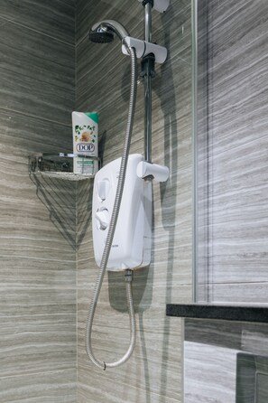 Shower, hair dryer, towels, toilet paper