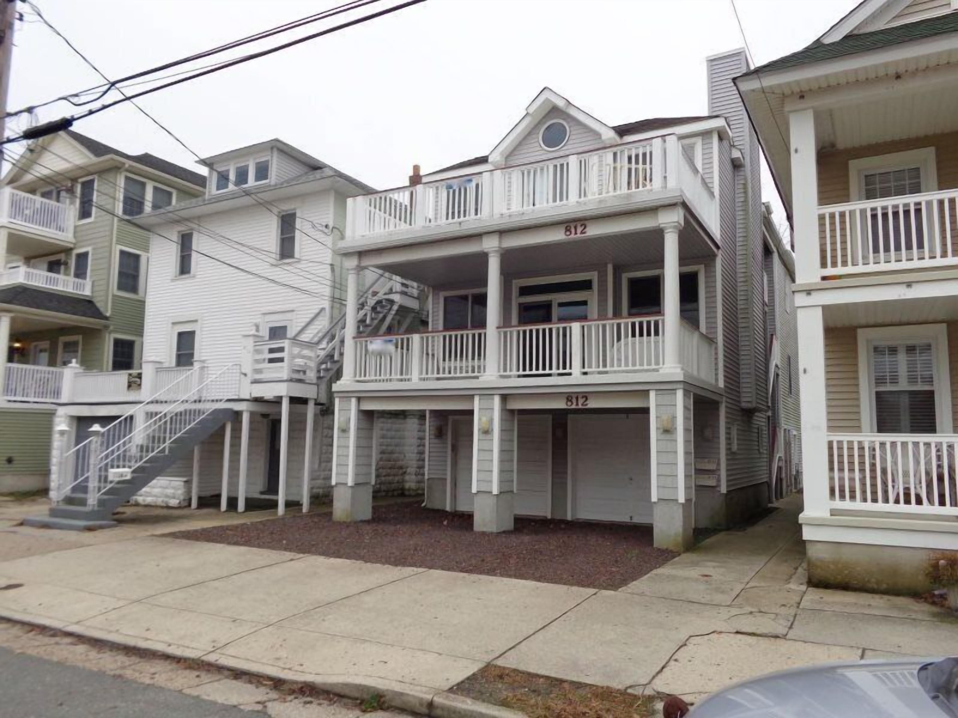 This three bedroom, two bath, second floor condo is one block from the beach.