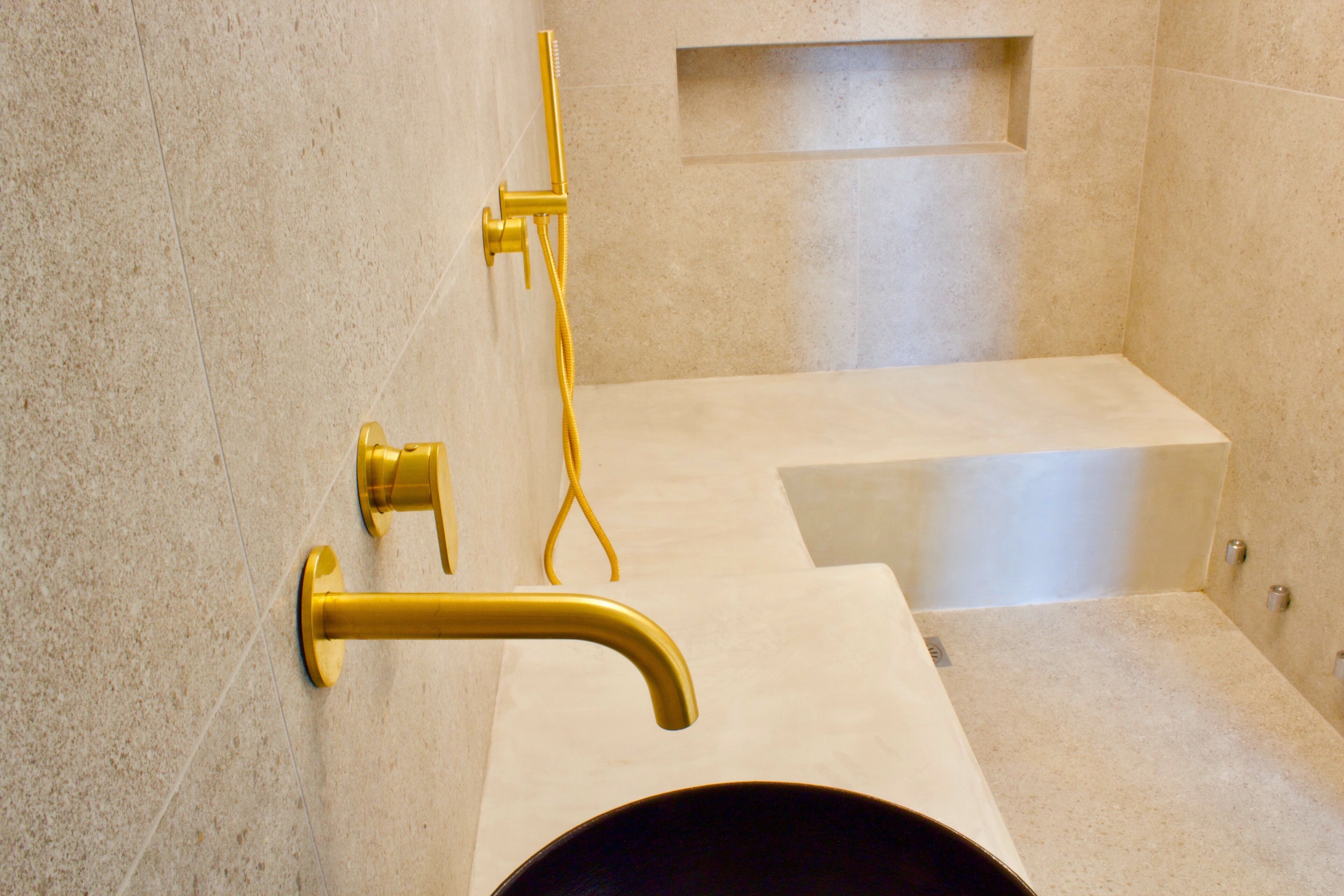 A bathroom with a bathtub, a shower, and a sink.