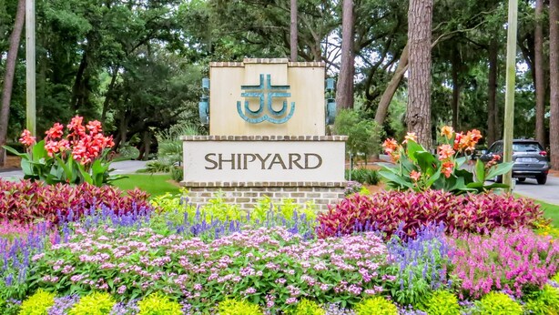 A sign with "SHIPYARD" and a symbol, surrounded by a colorful flower garden. - Brigantine Quarters, Shipyard Plantation, Hilton Head 2 bed/2 bath condo (Hilton Head)
