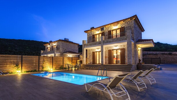 A two-story stone house with a swimming pool and outdoor seating. - Orient Villas Deluxe (Zakynthos)