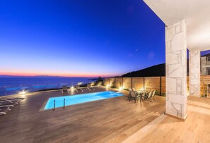 Seasonal outdoor pool, pool umbrellas, pool loungers