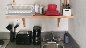 Coffee/tea maker, fridge, stovetop, toaster