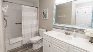 Bathtub, hair dryer, towels, soap