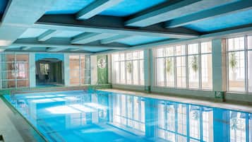 Indoor pool, open 7:00 AM to 10:00 PM, pool loungers