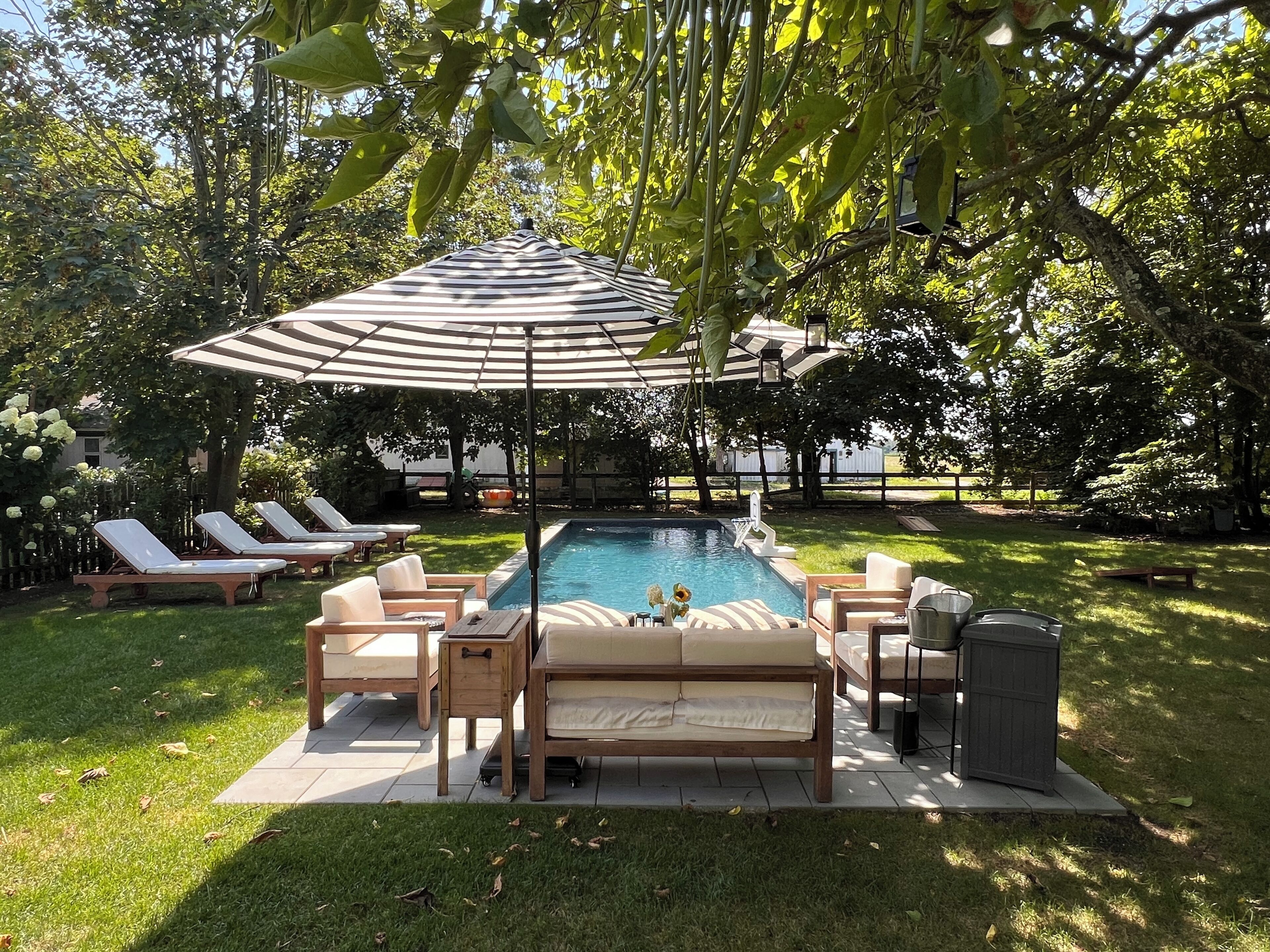 Heated outdoor pool with lounge chairs, plus sitting area w/ sofa and chairs 