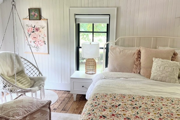 Bedroom 2- sun-drenched, Queen bed, desk and swing chair overlooking backyard
