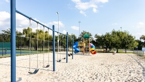 A playground with swings and a slide. - Adorable Townhome with Water Views (Jacksonville)