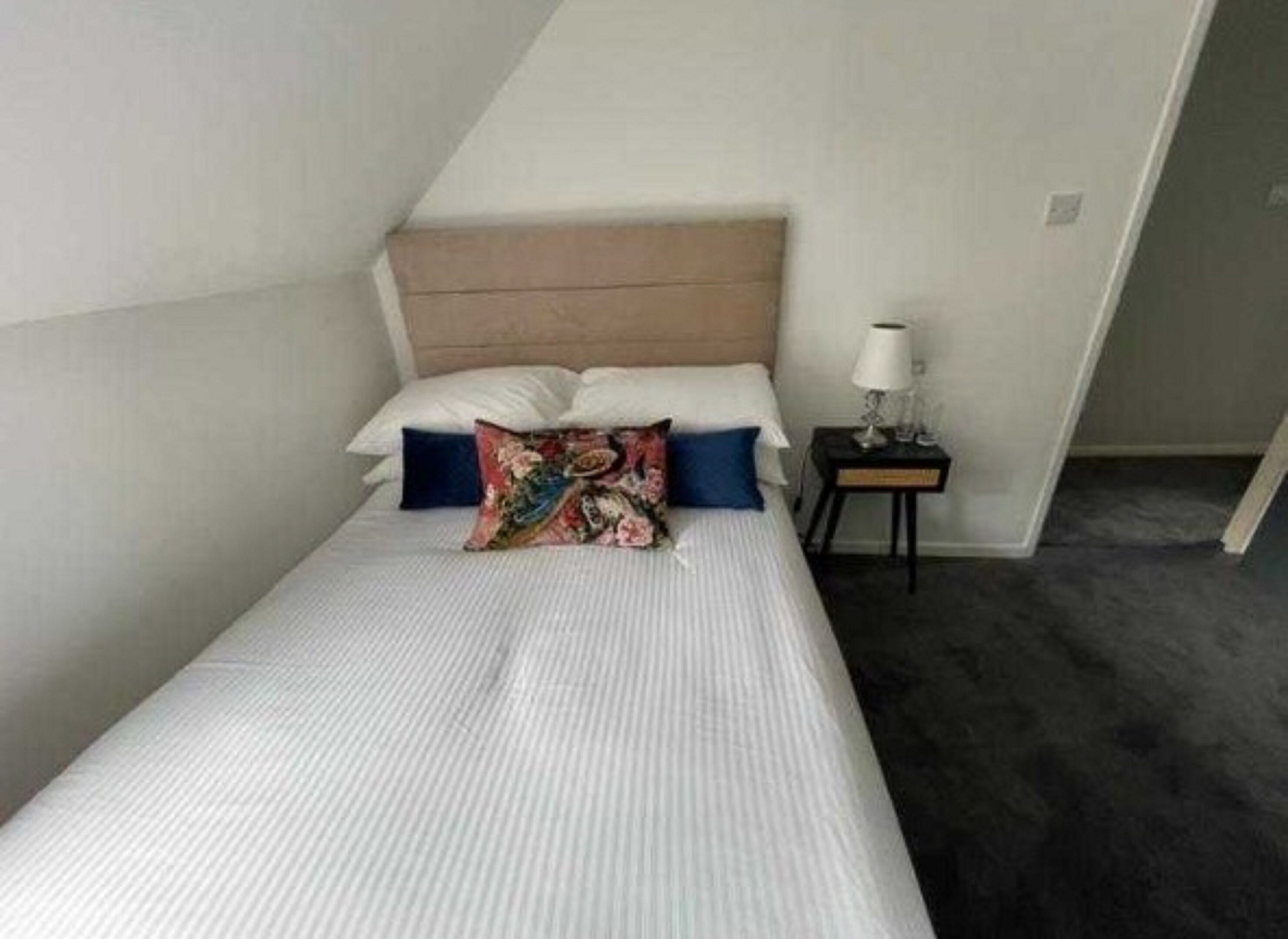 family room, multiple beds (family of 3) | iron/ironing board, bed sheets