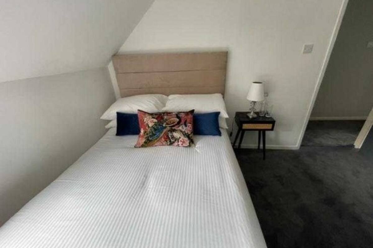 family room, multiple beds (family of 3) | iron/ironing board, bed sheets