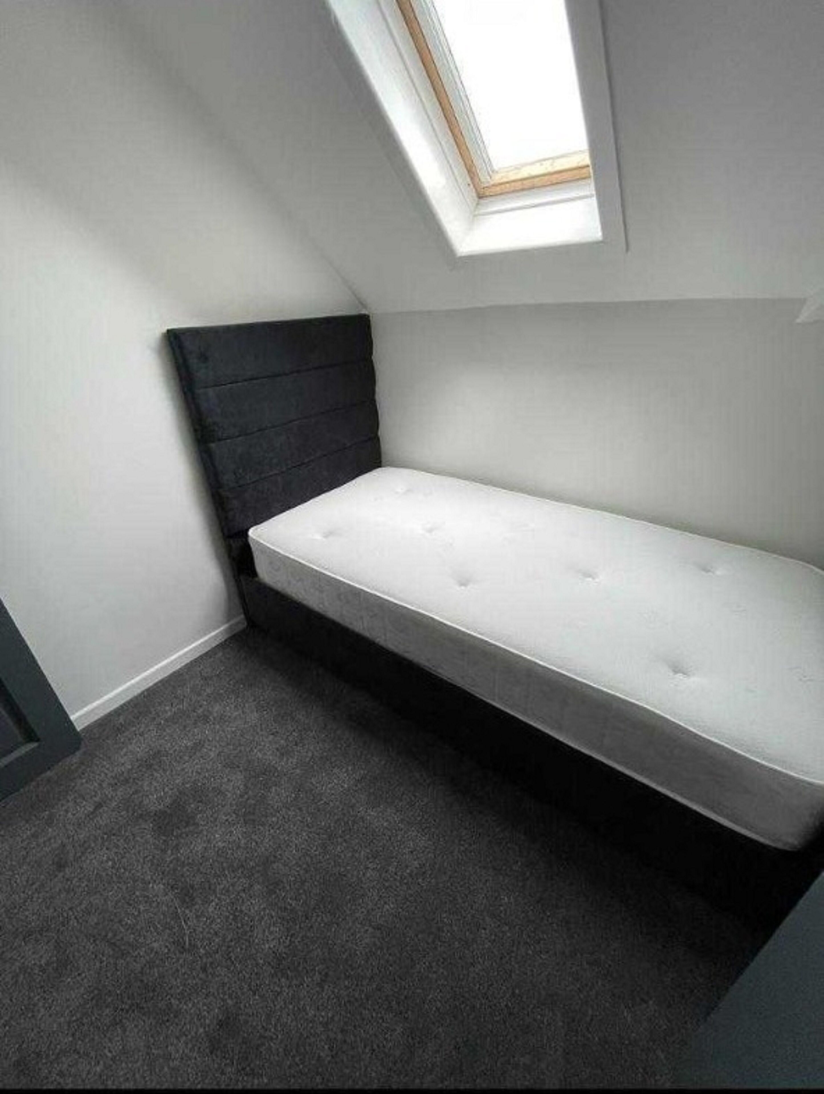 family room, multiple beds (family of 3) | iron/ironing board, bed sheets